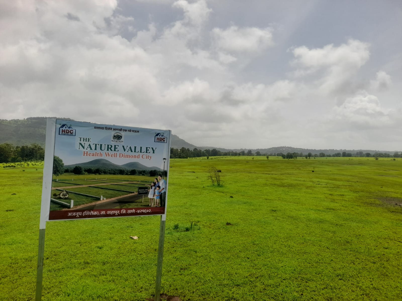 Project signboard at the Healthwell Diamond City land in Shahapur