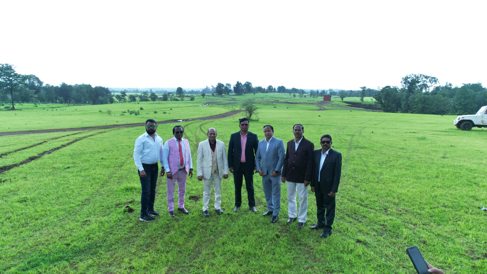 Healthwell Diamond City team standing at the project land