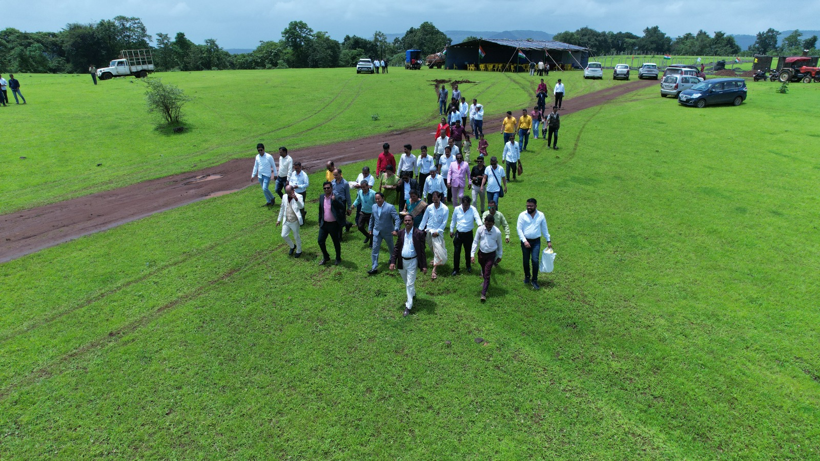 Visitors walking across the open green land at Healthwell Diamond City